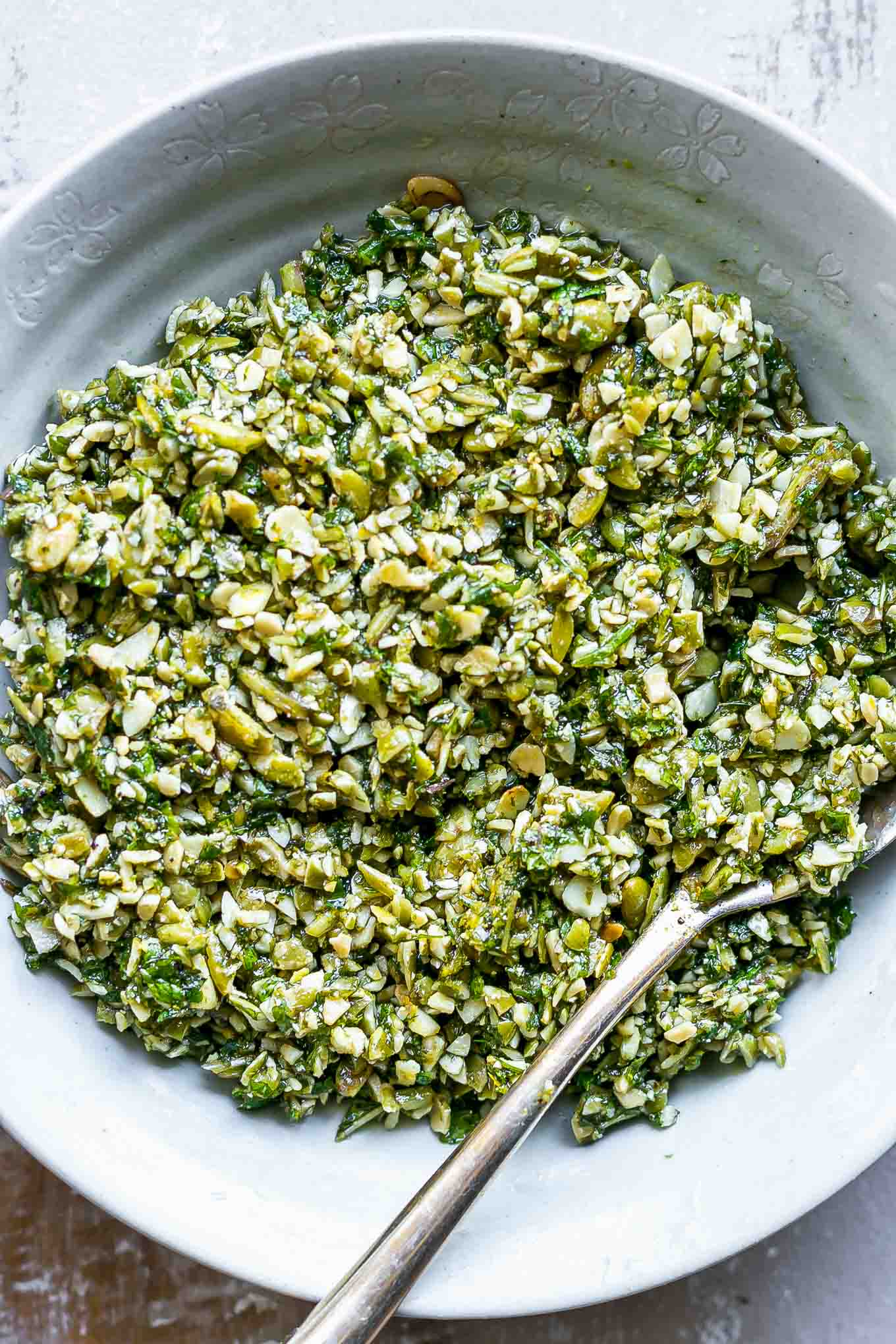 a close up photo of mint pesto sauce in a bowl