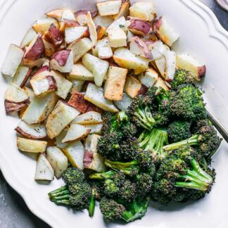 a white side dish with roasted potatoes and broccoli