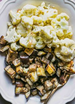 a close up photo of roasted eggplant and cauliflower