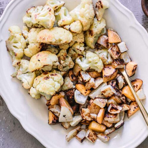 baked turnips and cauliflower on a white plate