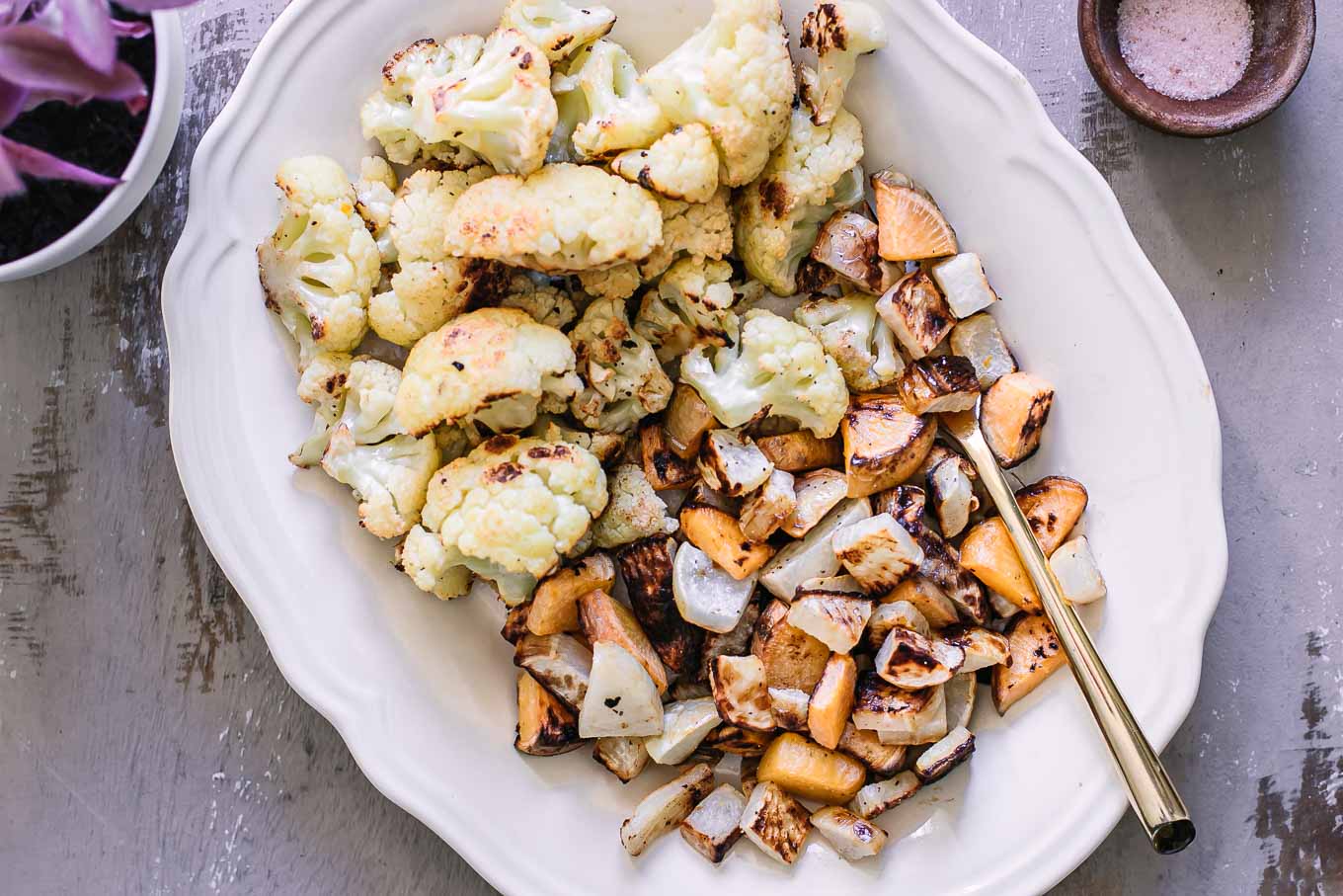 baked turnips and cauliflower on a white plate