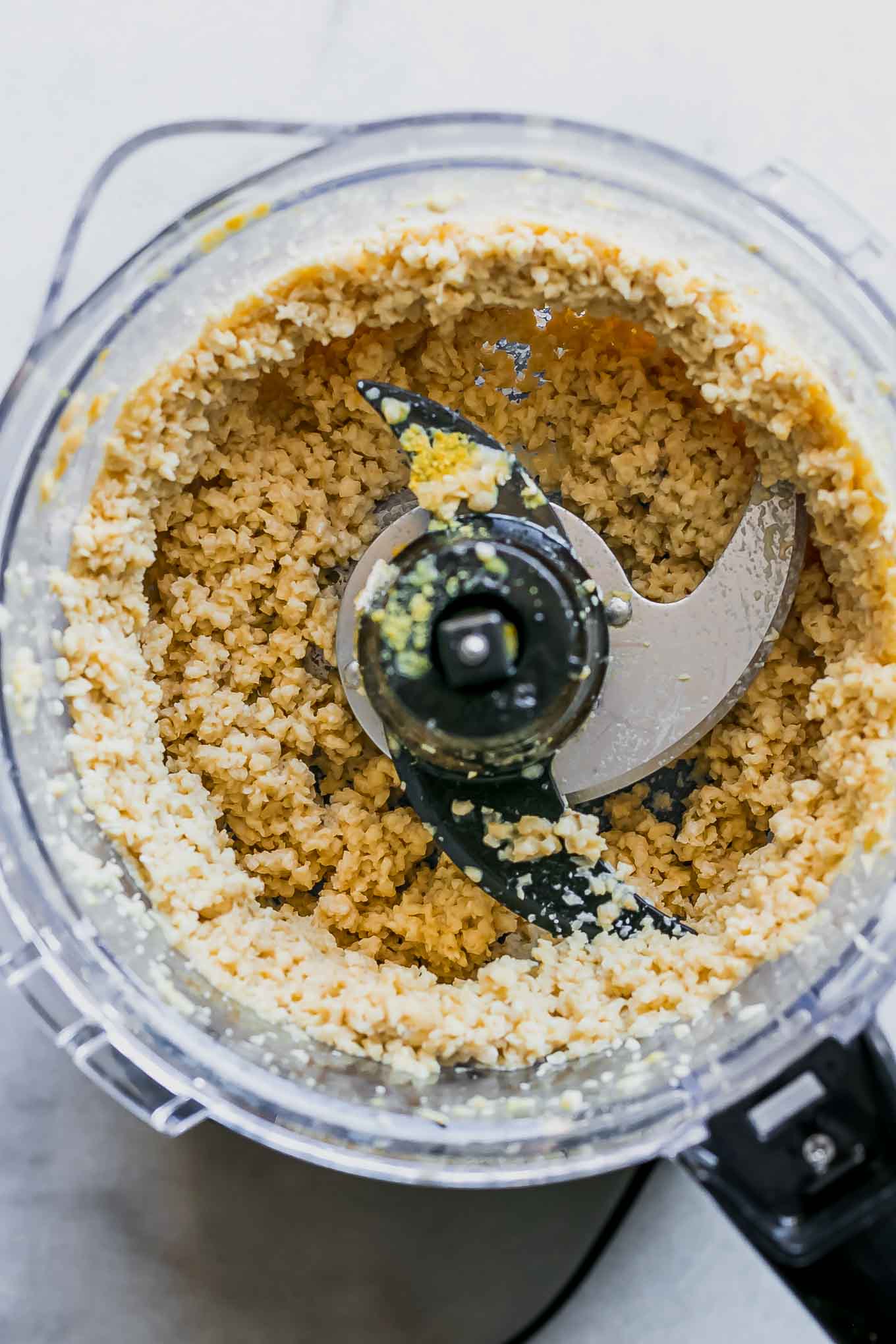 blended vegan cashew ricotta ingredients inside a food processor after blending