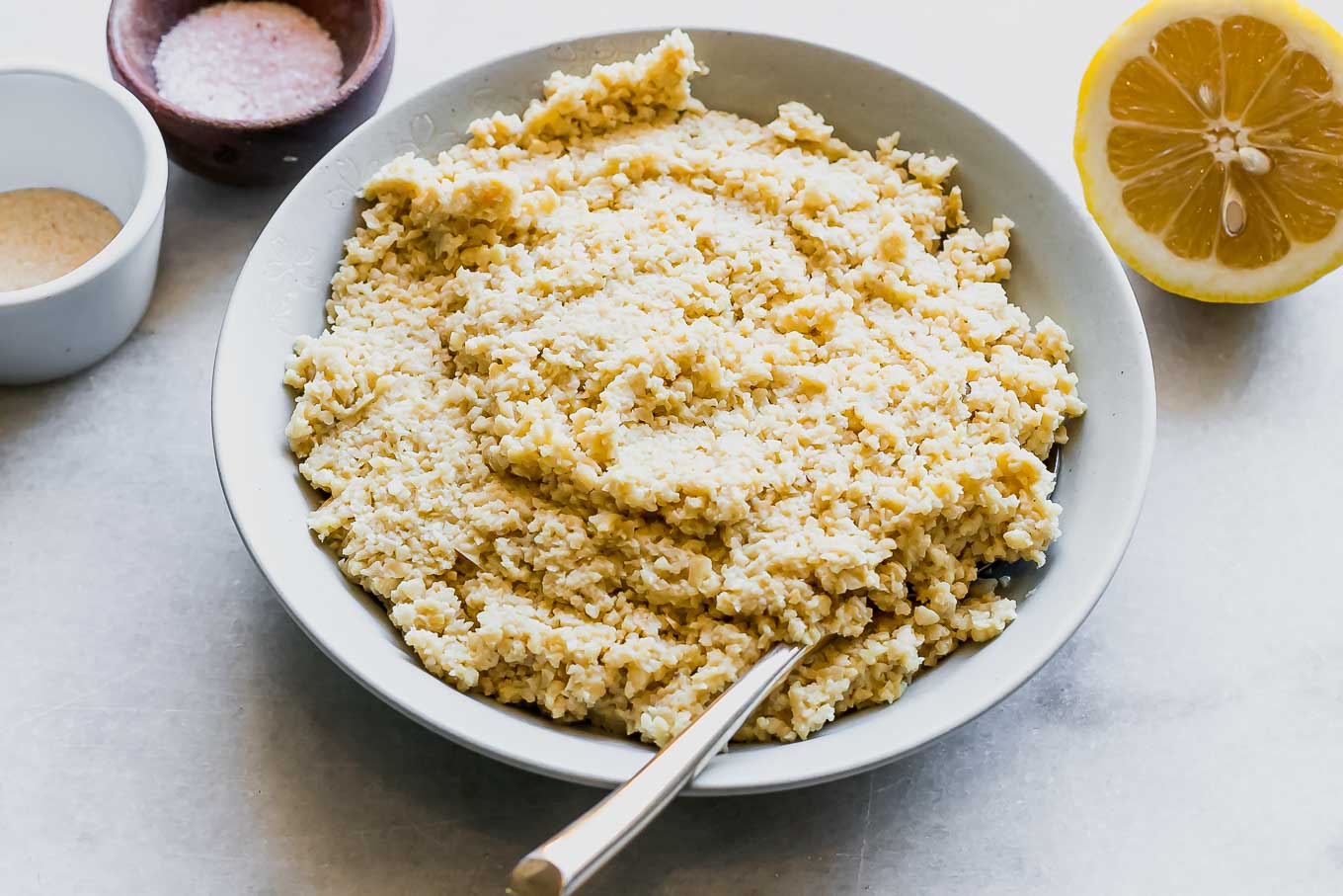 a bowl of cashew ricotta cheese on a white table