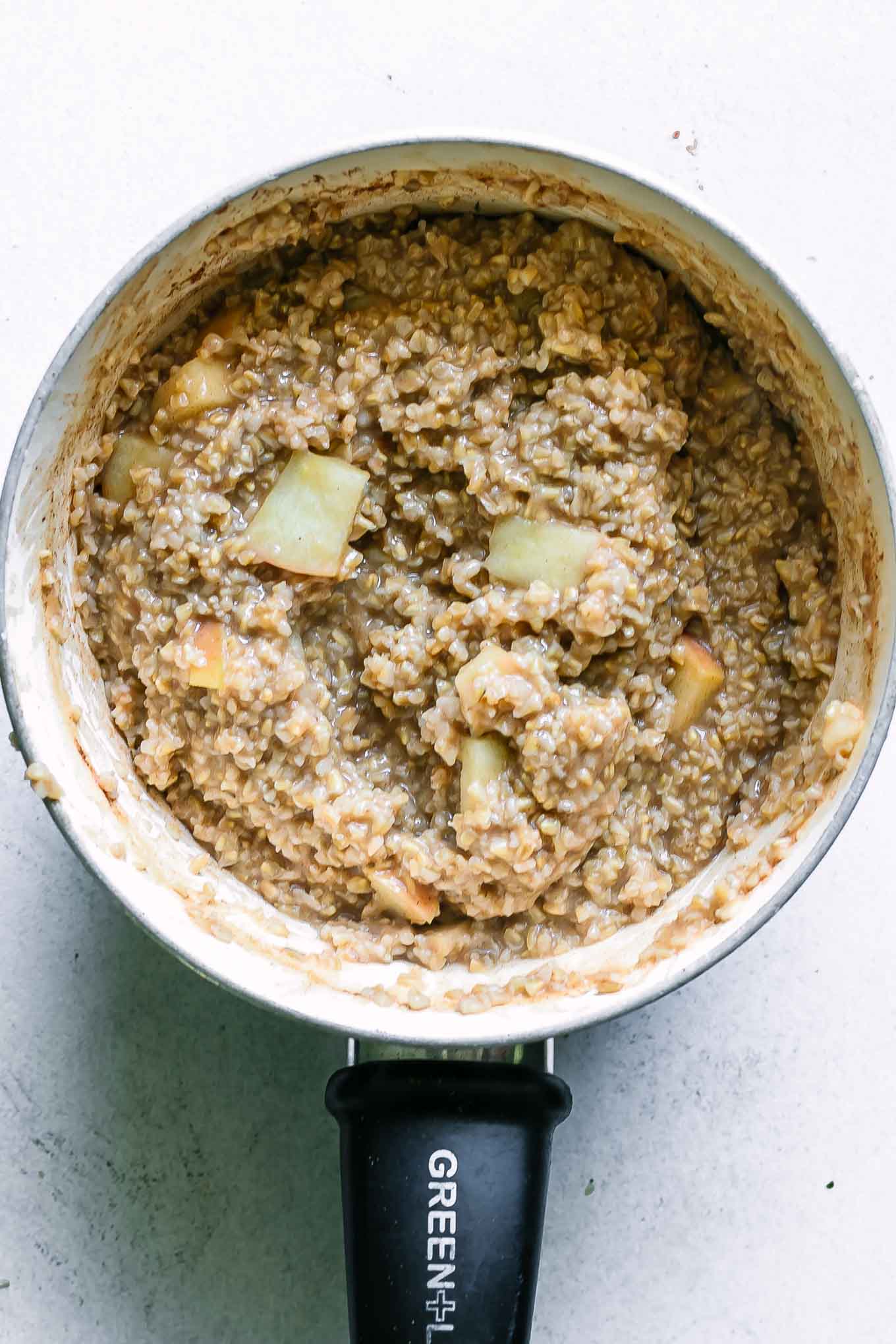 cooked apple and cinnamon oatmeal in a pot