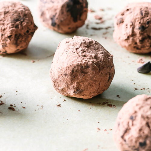 rolled brownie bite snack balls on a parchment paper