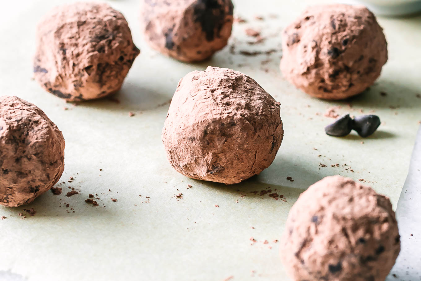 rolled brownie bite snack balls on a parchment paper