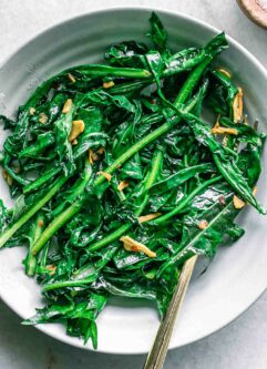 a close up photo of cooked dandelion greens in bowl