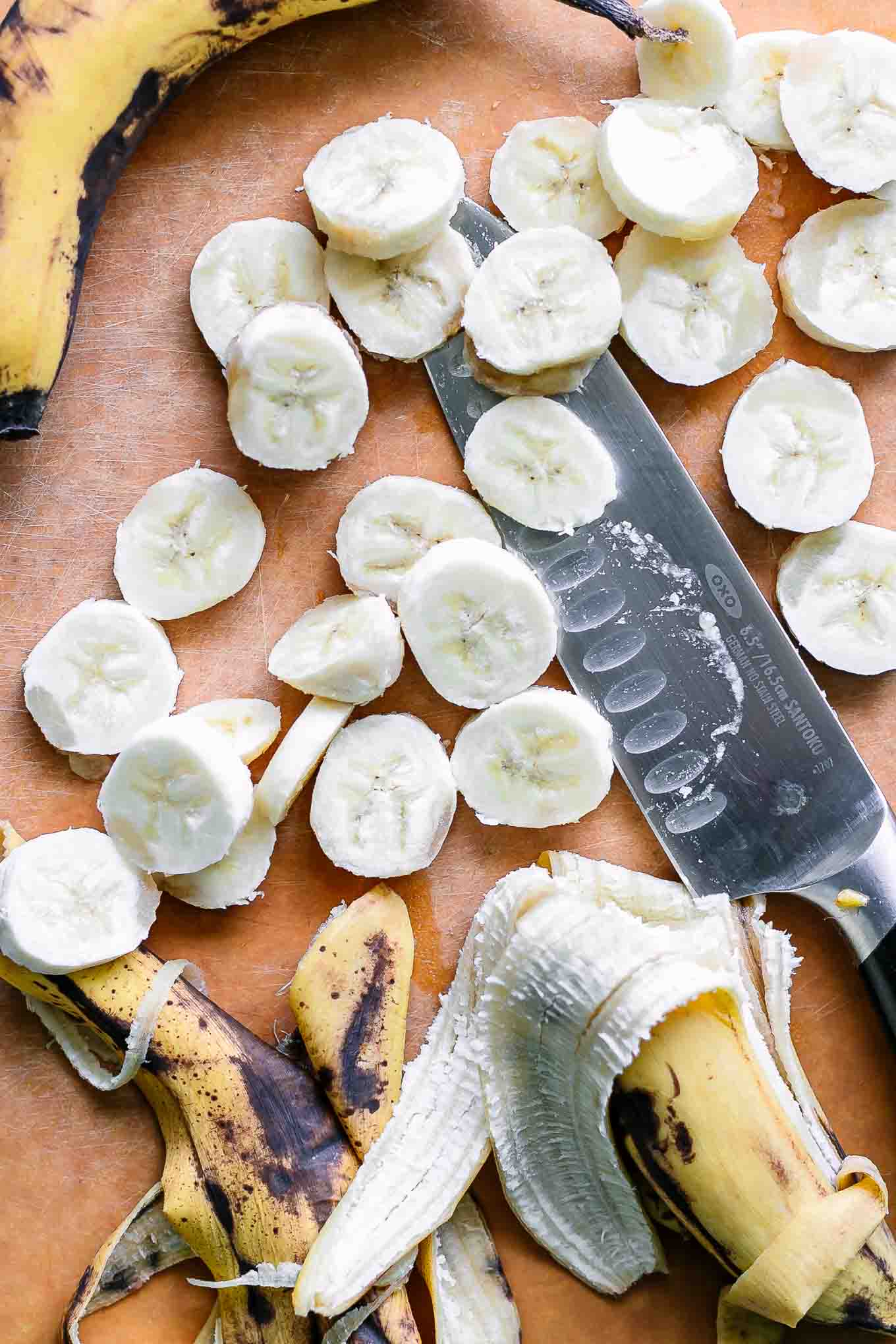 sliced bananas on a wood cutting board