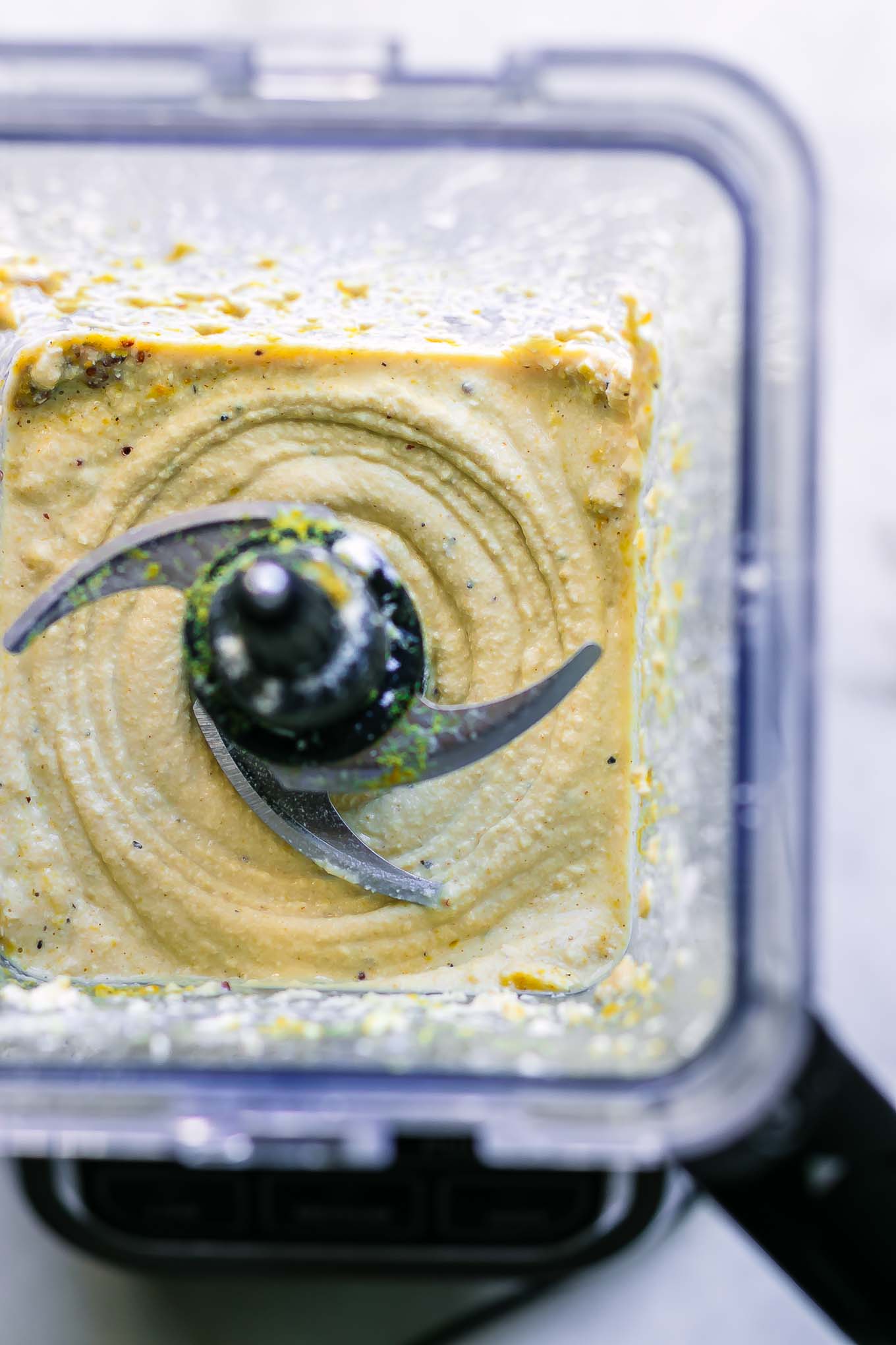 blended tofu and spices inside a blender