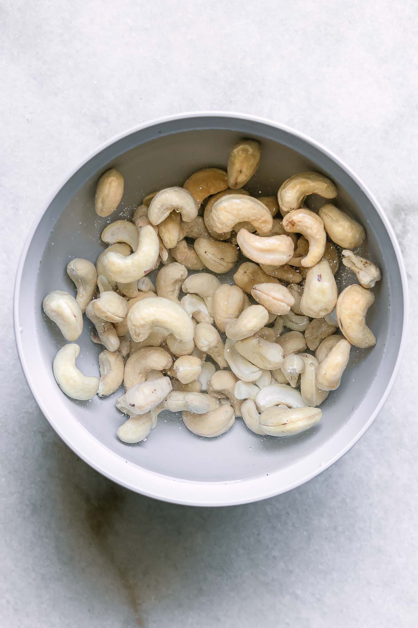 dates soaking in a bowl with hot water