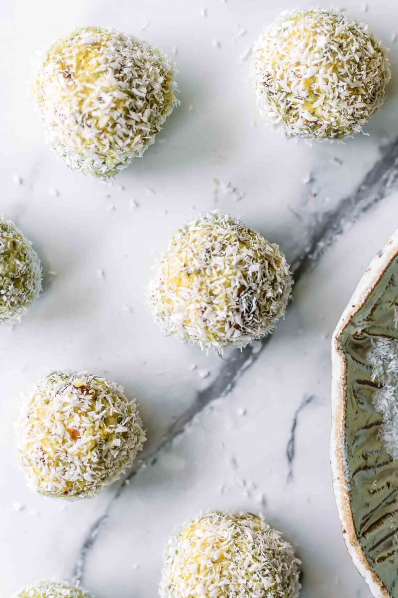small coconut lemon energy balls on a white table