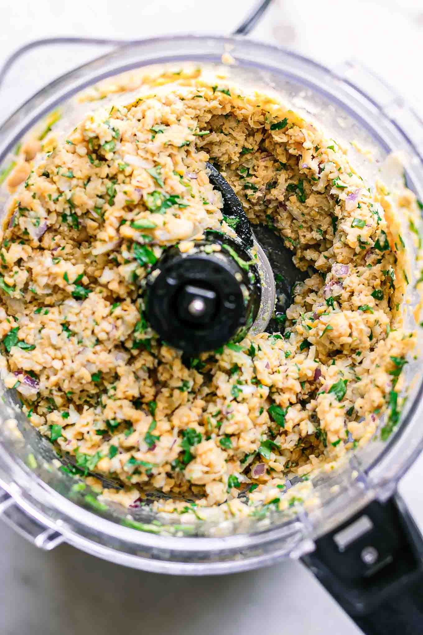 blended falafel ingredients inside a food processor after blending