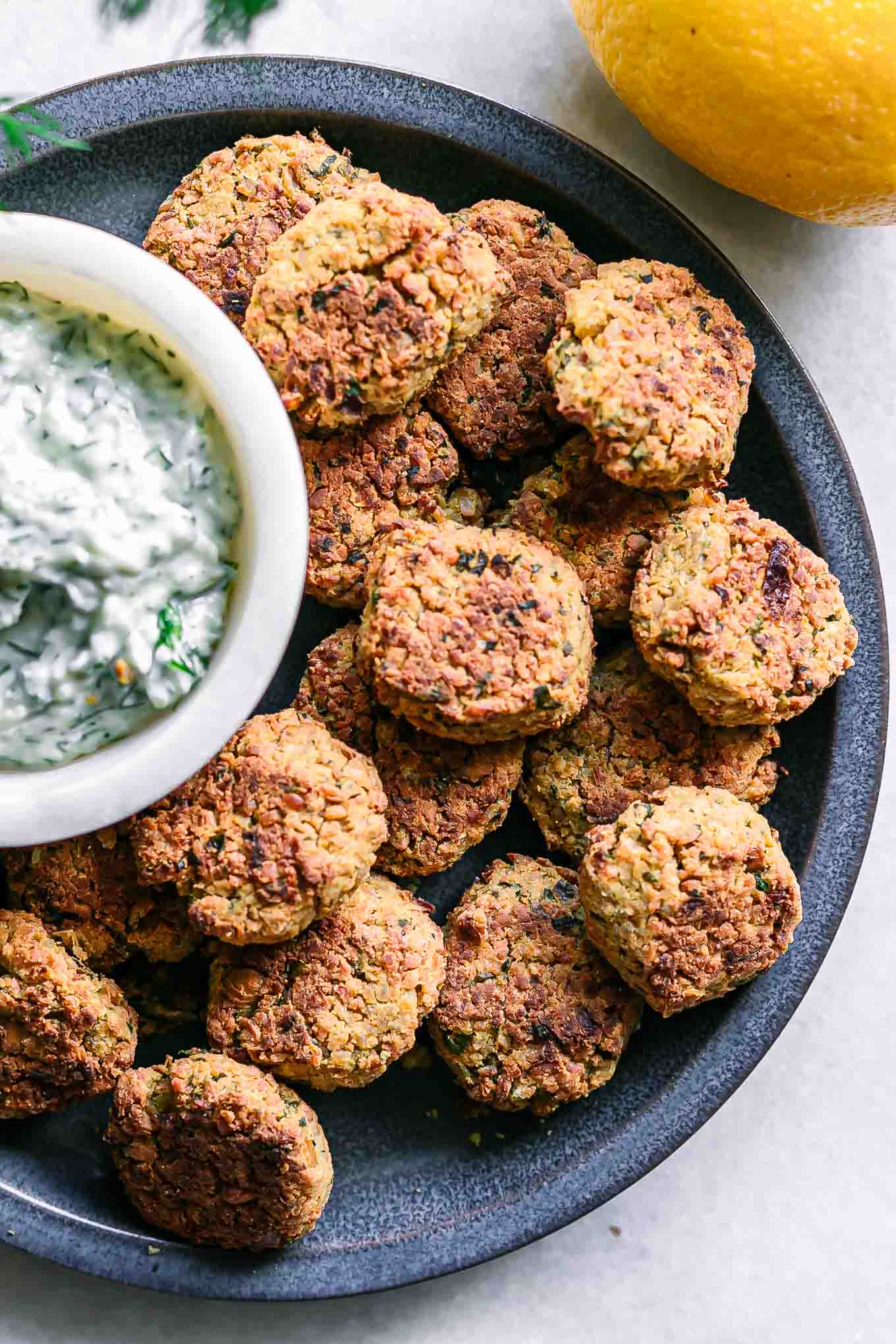 a close up photo on a blue plate of crispy falafel balls