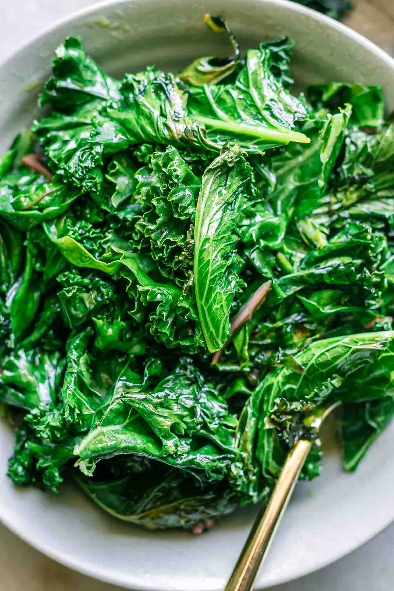 a close up photo of pan fried kale and chard