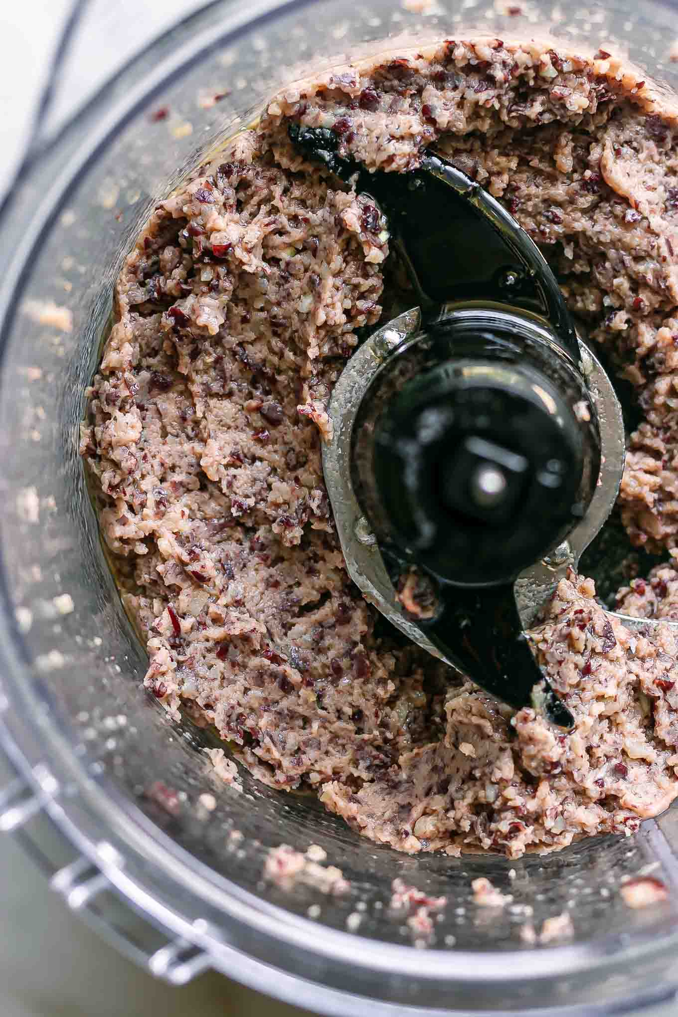 blended hummus made with kidney beans inside a food processor