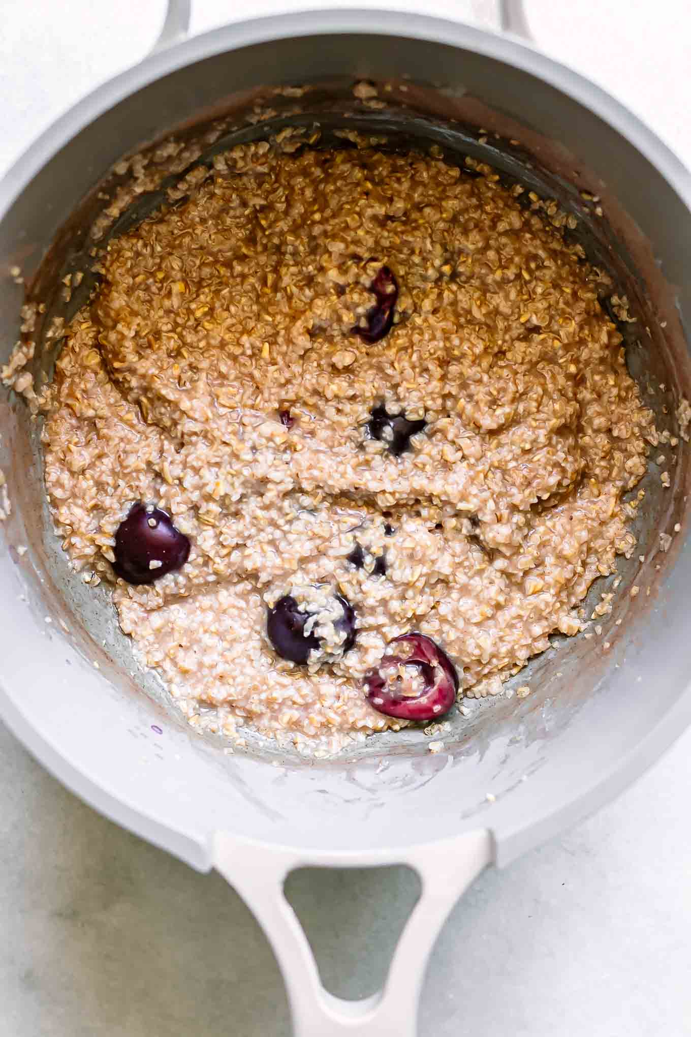 cooked cherry oatmeal in a pot