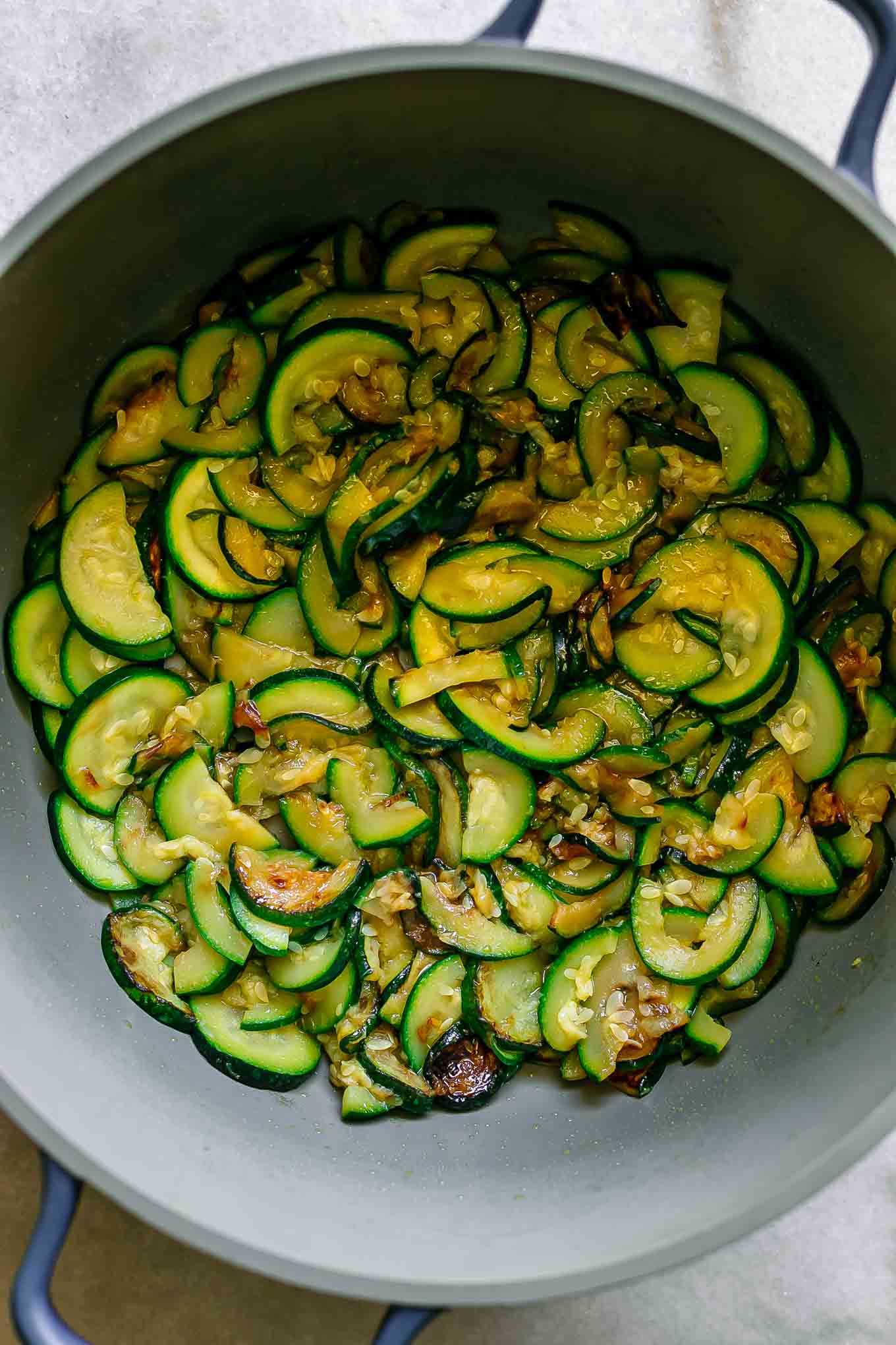 cooked zucchini slices inside a large pot