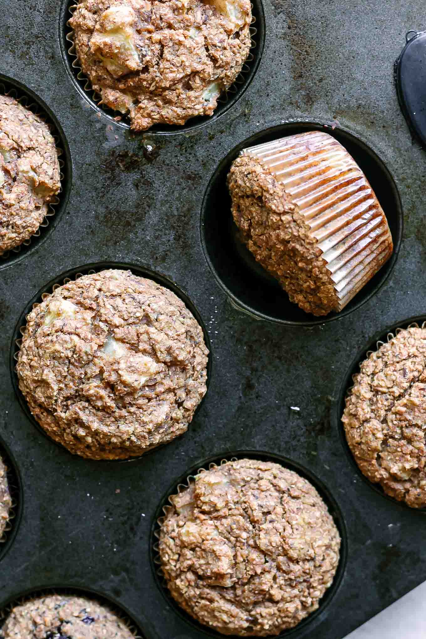 peach bran muffins in a muffin pan after baking