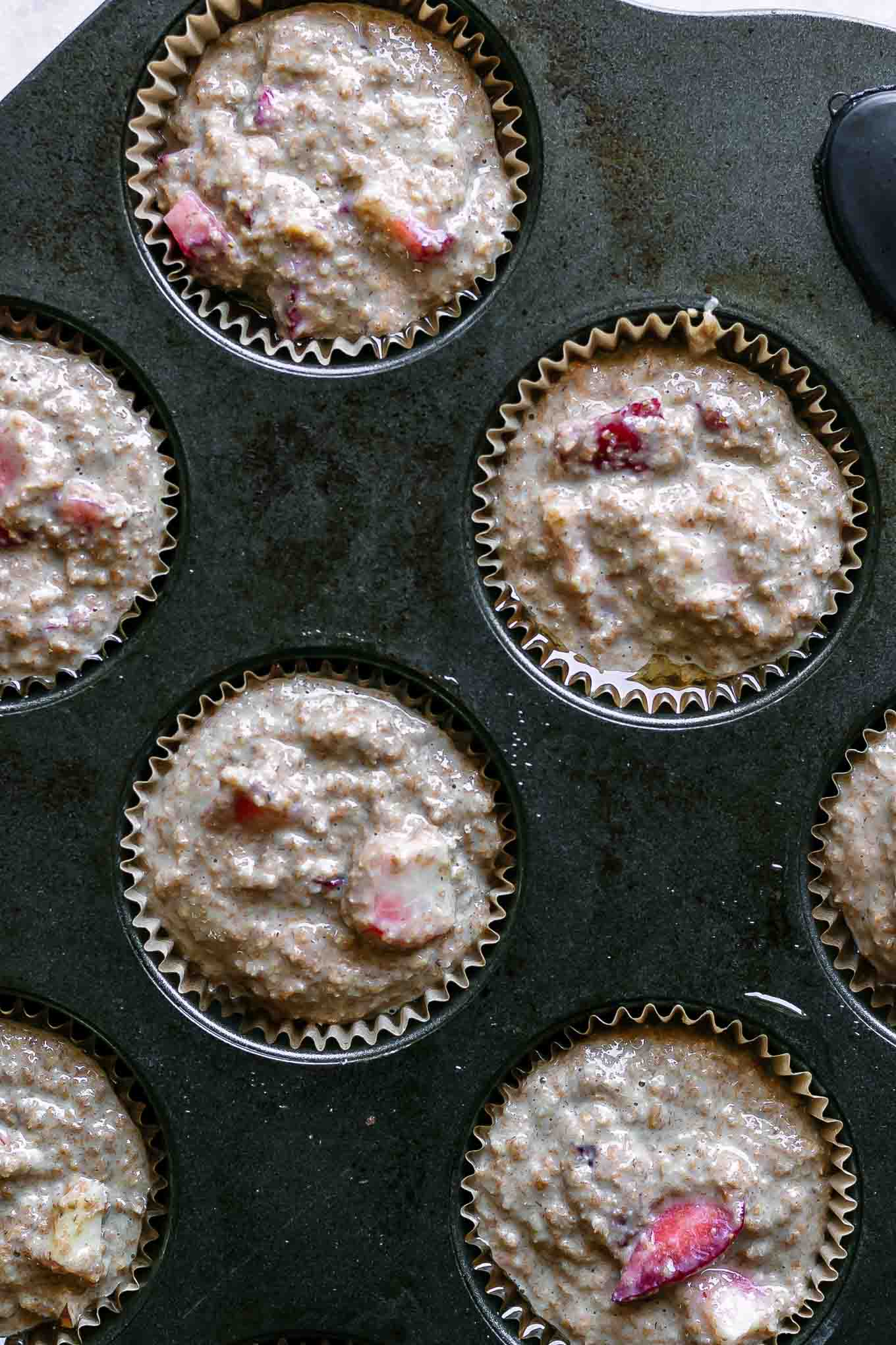 bran muffin batter in a muffin tin before baking