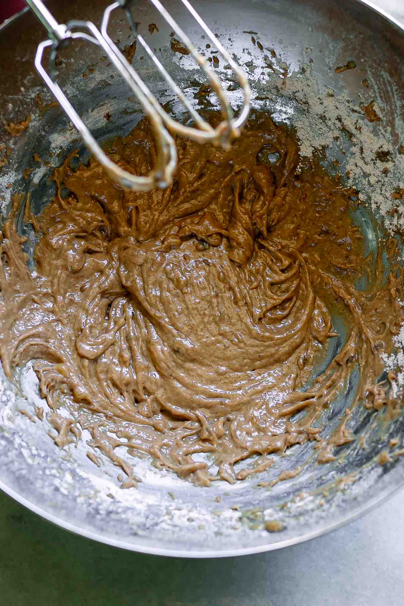 a mixing bowl with oatmeal cookie batter 