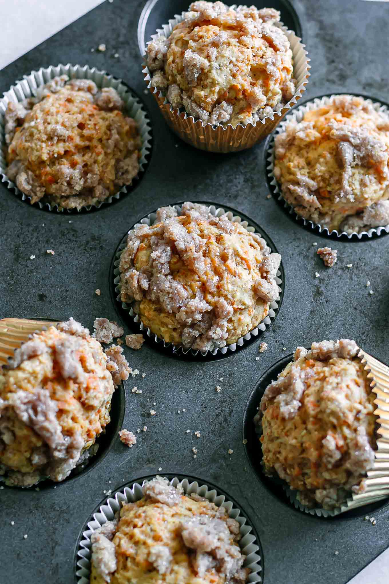 baked carrot cake muffins in a muffin tin