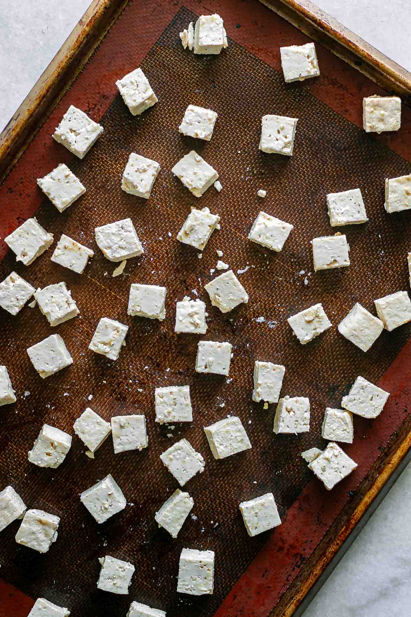 a sheet pan with tofu before baking