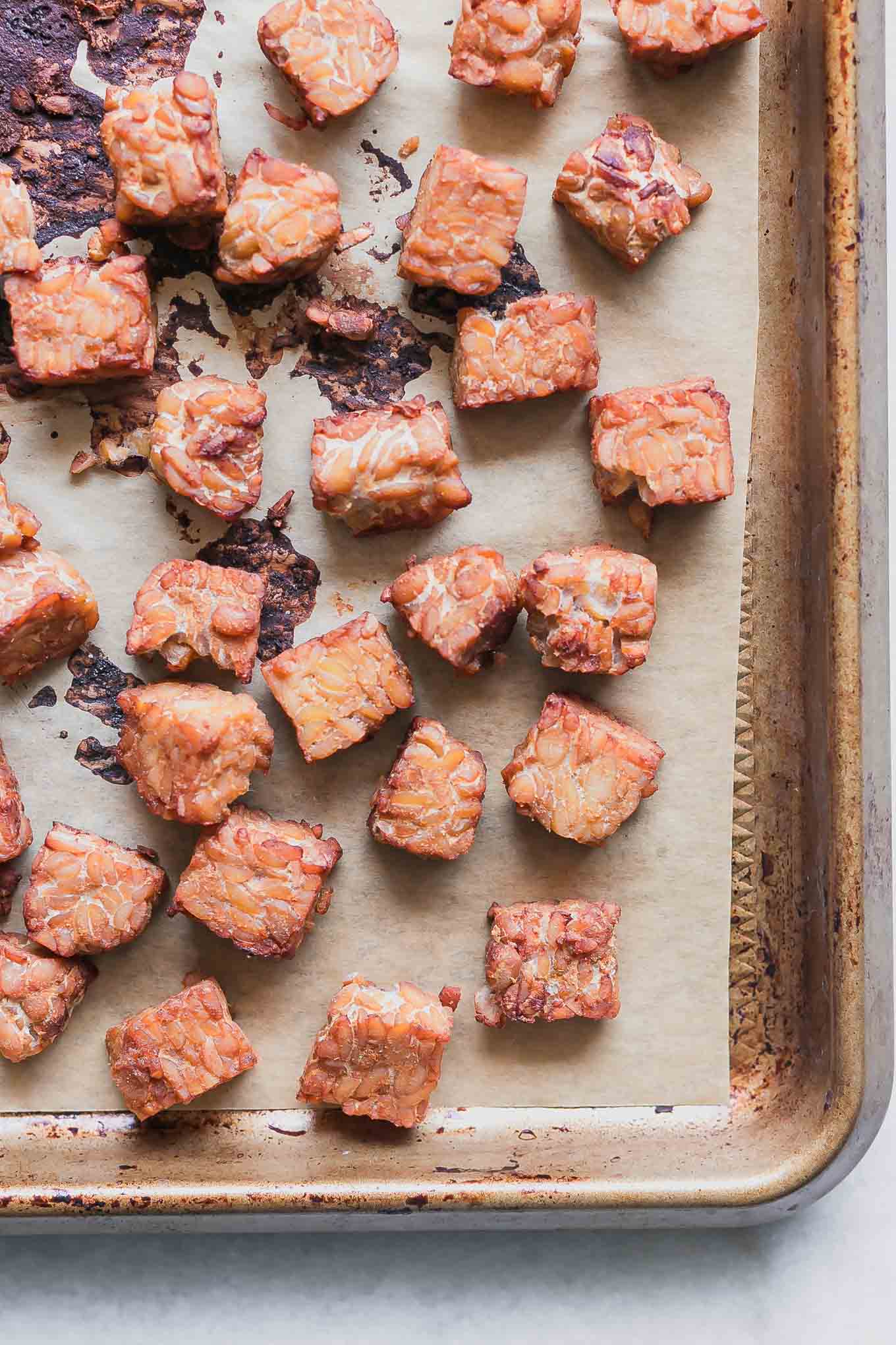 a sheet pan with baked tempeh after roasting