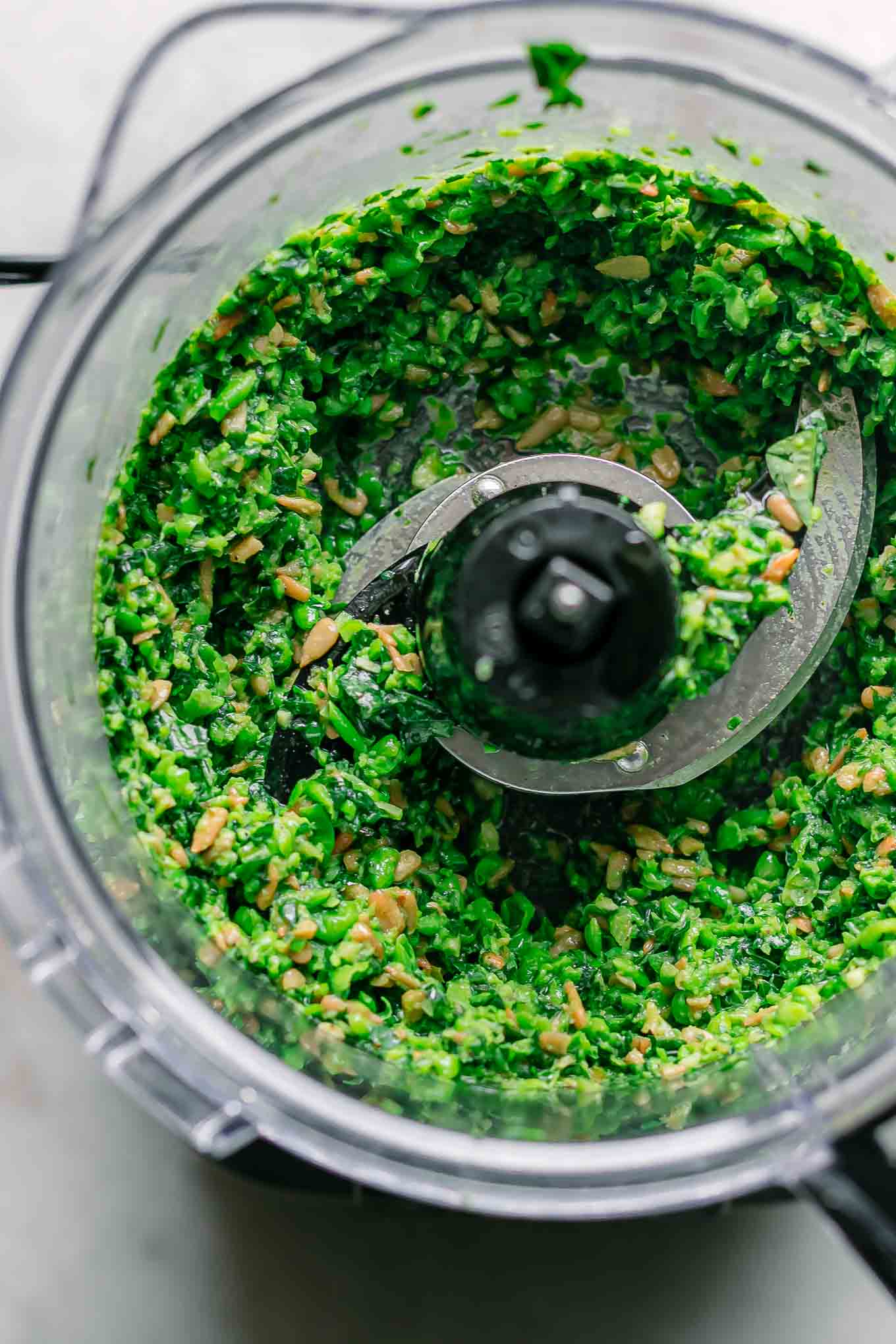 blended pea pesto inside a food processor