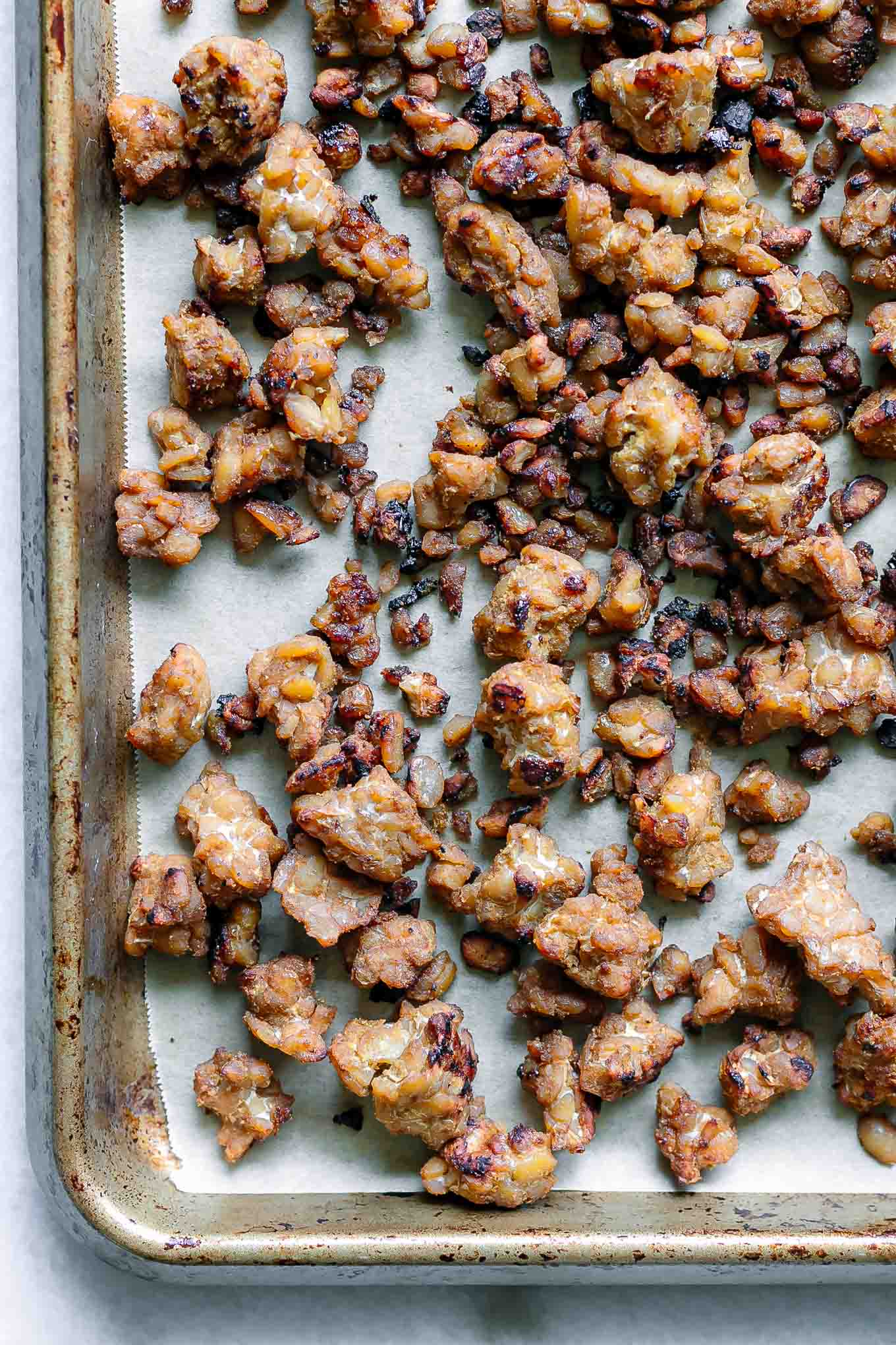 baked crispy tempeh on a baking sheet after roasting
