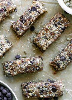 homemade tahini crunch bars with chocolate on a table