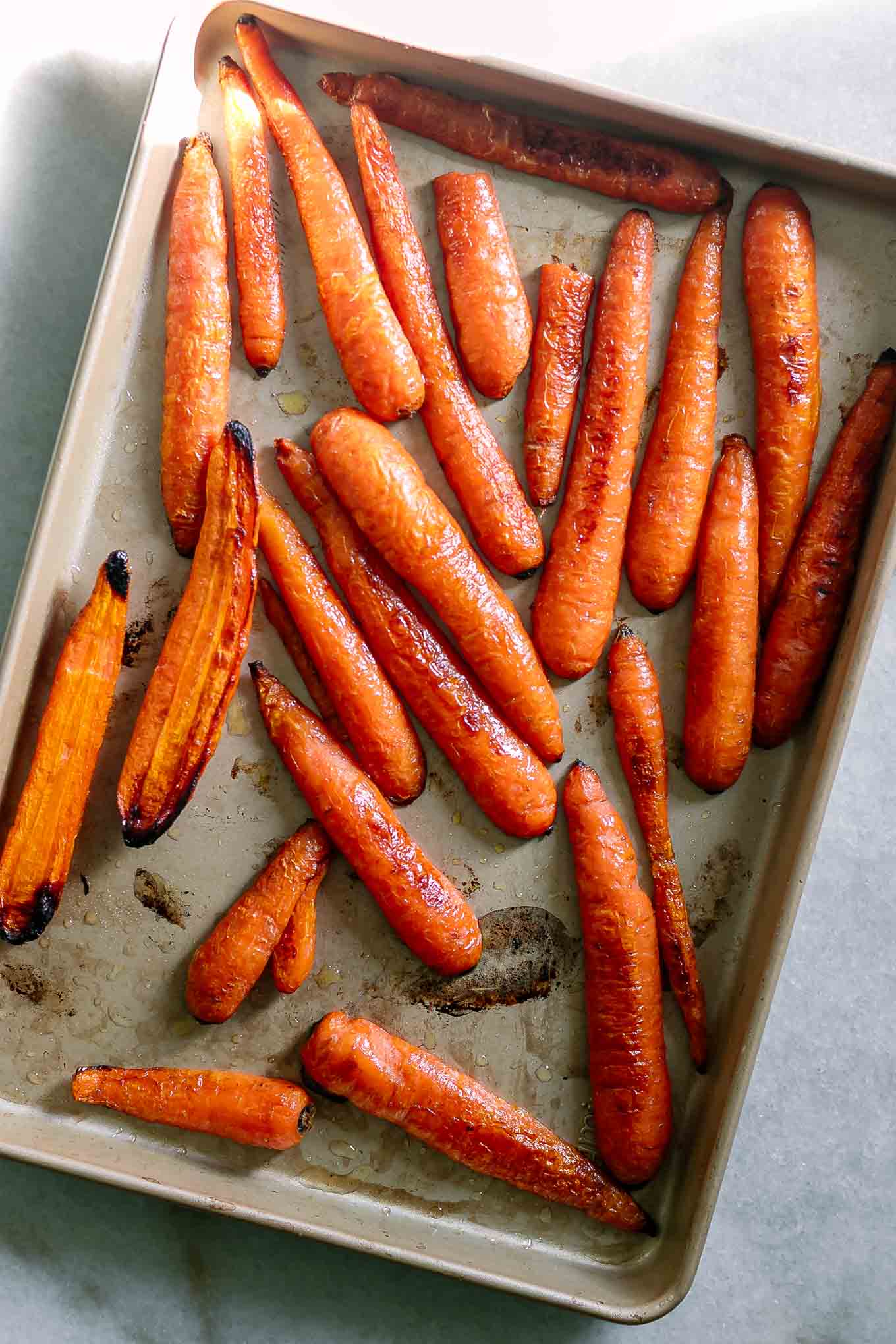 sliced carrots roasted on a baking sheet