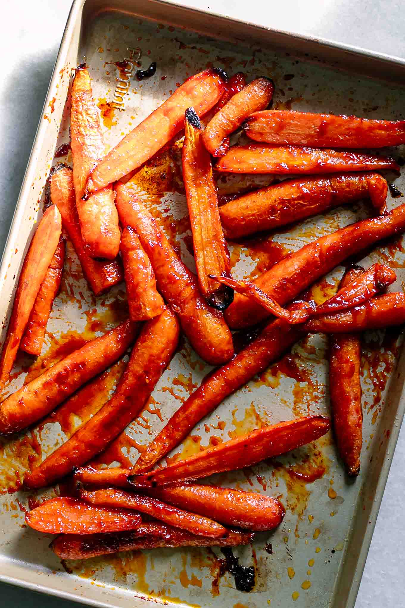 glazed gochujang carrots after roasting on a baking sheet