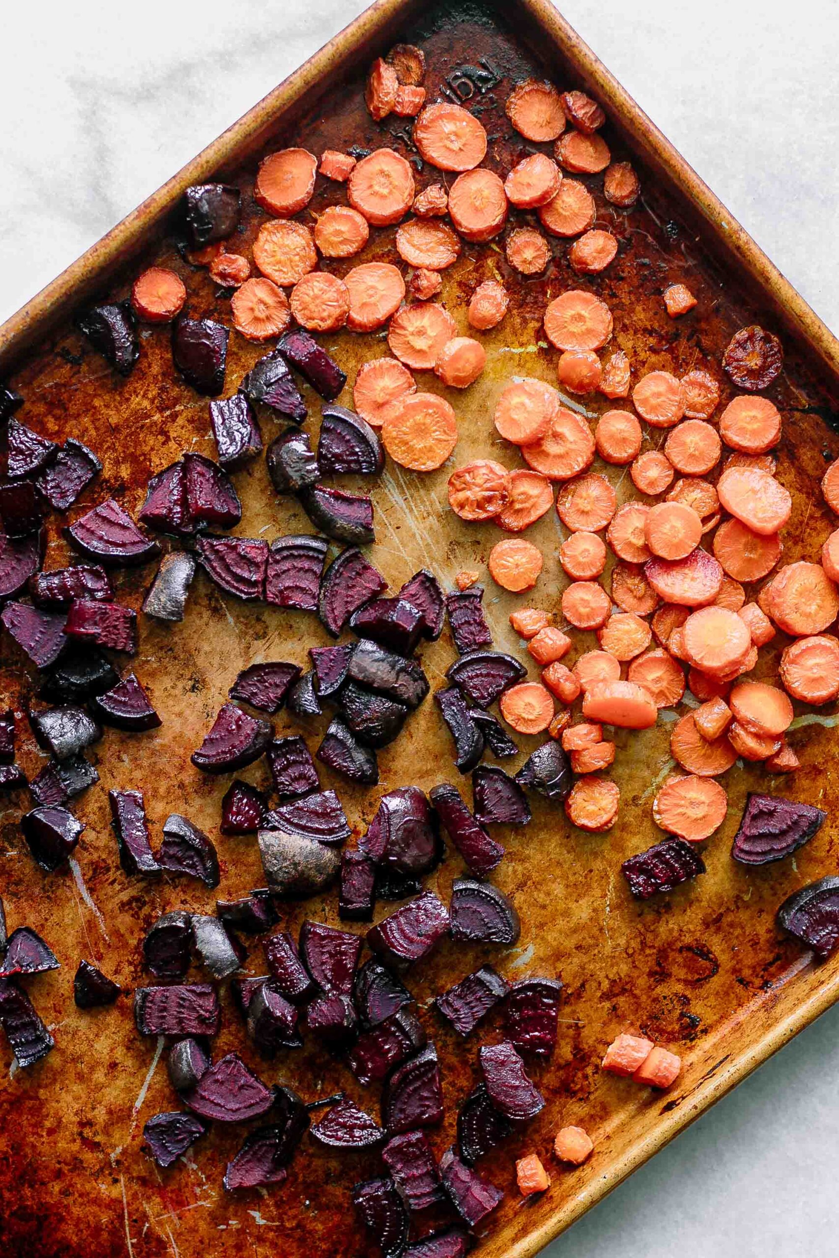 roasted carrots and beets on a sheet pan
